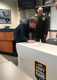 Mr. Anderson and COL Brower sign the ceremonial PaYS Memorandum of Agreement. Mr. Anderson and COL Brower sign the ceremonial PaYS Memorandum of Agreement.
