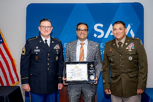 MAJ Vira and SFC Hicks of the TXARNG present Mr. Arora the PaYS Ceremonial Plaque for SAM, LLC.