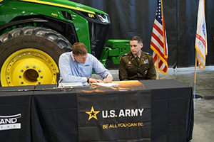 (l-r) Mr. Allen and CPT Miller sign the ceremonial agreement. (l-r) Mr. Allen and CPT Miller sign the ceremonial agreement.