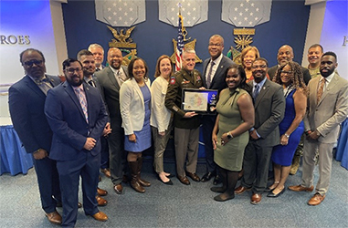 The PaYS and Ford teams pose with the Ceremonial Plaque presented to Mr. Smith by LTG Stitt. The PaYS and Ford teams pose with the Ceremonial Plaque presented to Mr. Smith by LTG Stitt.