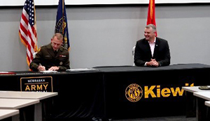 BG Strong and Mr. Medcalf sign the Kiewit ceremonial MOA.