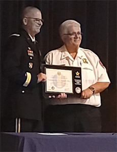 MG Waddell presents Louisiana State Fire Marshal Daniel Wallis with the PaYS Ceremonial Plaque.