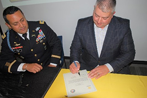 LTC Ceja and Mr. Shwartz sign the Ceremonial PaYS Memorandum of Agreement.