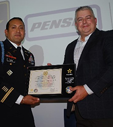 LTC Ceja presents the PaYS Ceremonial Plaque to Mr. Schwartz for Penske Truck Leasing Co., L.P. LTC Ceja presents the PaYS Ceremonial Plaque to Mr. Schwartz for Penske Truck Leasing Co., L.P.