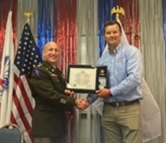 (l-r) LTC Horvath presents Mr. Vandergriend the Ceremonial Plaque