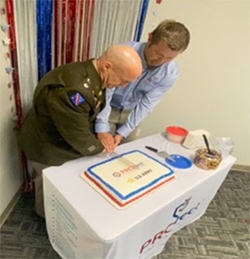 (l-r) LTC Horvath and Mr. Vandergriend cutting the cake following the ceremony.