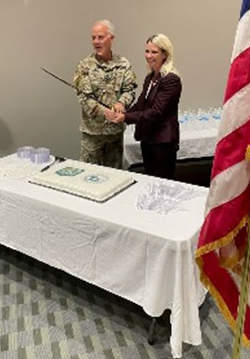 BG Ropers and Mrs. Burmeister cut the cake to start the reception following the ceremony.