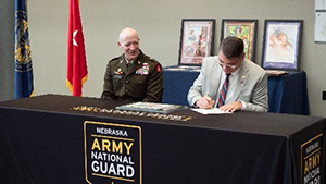 BG Heng and Mr. Hilgert sign the ceremonial MOA. BG Heng and Mr. Hilgert sign the ceremonial MOA.