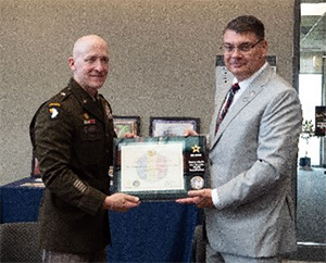 BG Heng and Mr. Hilgert pose with the PaYS Ceremonial Plaque.