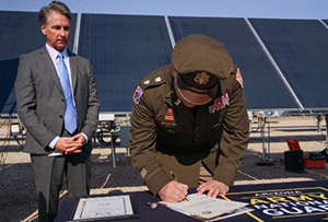LTC Smith signs the First Solar ceremonial MOA with Mr. Widmar.