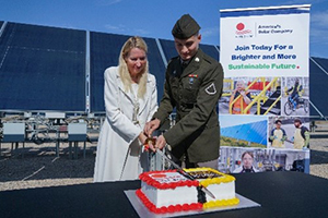 Mrs. Stockdale, First Solar, and PFC Bramlett, AZARNG, cut the cake to start the reception.