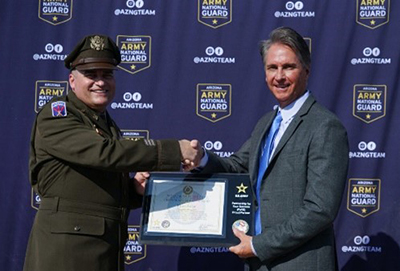 LTC Smith and Mr. Widmar pose with the PaYS Ceremonial Plaque.