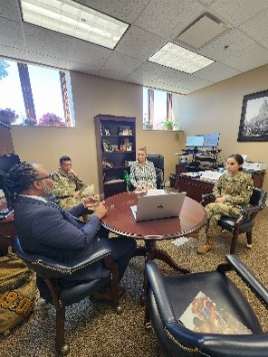 Samuel Armstrong giving an Army PaYS overview to Ms. Heather Fleming, Director of Human Resources, Montgomery County (Clarksville), 1LT Nina Bryant, Commander, Nashville Recruiting Company, and 1SG Jonathon Geyer