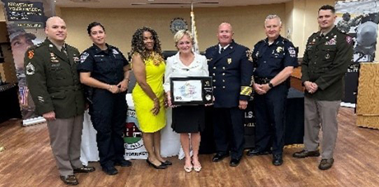 L to R - SFC Paul Jette, Station Commander, Torrington Recruiting Station, Officer Nicole Santiago, Torrington Police Department, Ms. Crancena Ross, PaYS marketing Analyst, Mayor Elinor Carbone, Mayor of Torrington, CT., Eric Borden, Fire Chief of Torrington, William Baldwin, Police Chief Torrington, LTC Andrew Merchant, Albany Recruiting Battalion. 