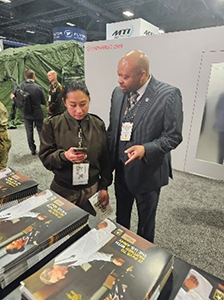 Antonio Johnson assists LTC Jo Forry registering to become a PaYS Soldier