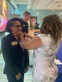 Ms. Brewer was pinned with a PaYS lapel by PaYS Marketing Analyst Crancena Ross Ms. Brewer was pinned with a PaYS lapel by PaYS Marketing Analyst Crancena Ross
