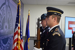 A joint color guard made up of Nebraska State Troopers and Cadets from the University of Nebraska posts the Colors.