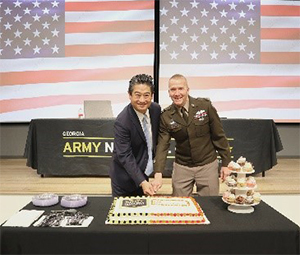 (l-r) Steven Jahng and MG Thomas Carden cutting the ceremonial cake (l-r) Steven Jahng and MG Thomas Carden cutting the ceremonial cake