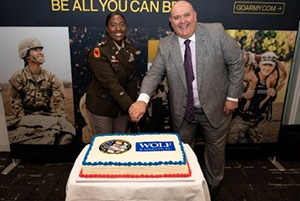(l-r) LTC Monroe and Mr. Gerald Gagne cut the cake following the ceremony. 