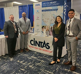 Raymond Snow and Samuel Armstrong with Cintas representatives 