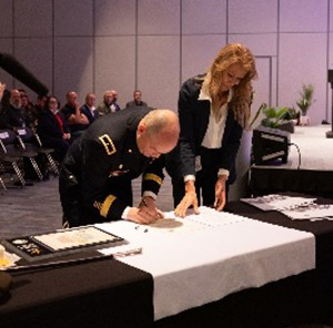 BG Packwood and Ms. Arnzen sign the ceremonial PaYS Memorandum of Agreement. BG Packwood and Ms. Arnzen sign the ceremonial PaYS Memorandum of Agreement.