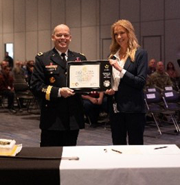 BG Packwood presents Ms. Arnzen with the PaYS Partner Plaque.