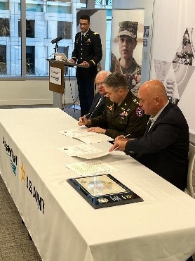 LTC Culver signs the Amsted Rail ceremonial MOA with Mr. Carter.