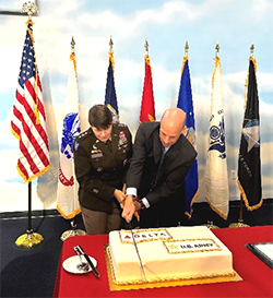 LTG Gervais and Mike Spanos cut the ceremonial cake with a saber LTG Gervais and Mike Spanos cut the ceremonial cake with a saber