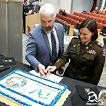 LTC Tammy Bogart and Mayor Kell Palguta cut the ceremonial cake