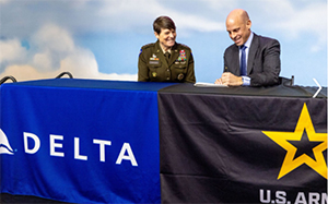 LTG Maria Gervais, Deputy Commanding General, Chief of Staff, TRADOC AND Mike Spanos, Chief Operating Officer, Delta Airlines signing the ceremonial agreement LTG Maria Gervais, Deputy Commanding General, Chief of Staff, TRADOC AND Mike Spanos, Chief Operating Officer, Delta Airlines signing the ceremonial agreement