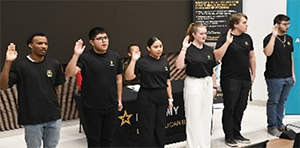 Future Soldiers from the Charlotte Recruiting Company take the oath of enlistment.  