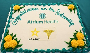 A cake cutting ceremony was performed doing the ceremony between the Army and Atrium Health 