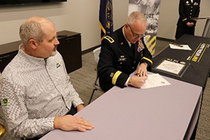 BG Ropers and Mr. Hochstein sign the ceremonial agreement. BG Ropers and Mr. Hochstein sign the ceremonial agreement.