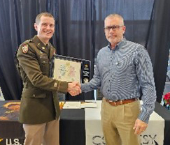 LTC Cox presenting Chris Grace the PaYS plaque. 