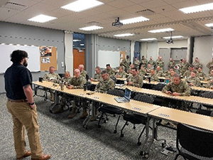 Travis Carter conducting a PaYS briefing 