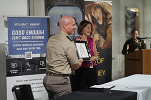 LTC Justin Ducote and Trish Mowry presenting the plaque of partnership LTC Justin Ducote and Trish Mowry presenting the plaque of partnership