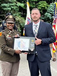 (l-r) LTC Diontanese Monroe, Commander, New England Recruiting Battalion presents the PaYS plaque to Michael Conroy, Director of Recruiting and Field Operations, Northeast Security, Inc. (l-r) LTC Diontanese Monroe, Commander, New England Recruiting Battalion presents the PaYS plaque to Michael Conroy, Director of Recruiting and Field Operations, Northeast Security, Inc.