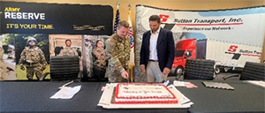 CPT Matthew Olson and Cliff Sutton cut ceremonial cake CPT Matthew Olson and Cliff Sutton cut ceremonial cake