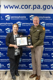 MG Schindler presents Dr. Harry with plaque and certificate MG Schindler presents Dr. Harry with plaque and certificate