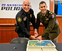 Chief W. Howard Harrison and MAJ Holtzman cut the cake Chief W. Howard Harrison and MAJ Holtzman cut the cake