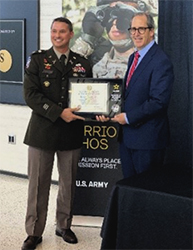 LTC Eliot Proctor, Commander, Milwaukee Recruiting Battalion presents plaque to Troy Streckenbach, County Executive, Brown County LTC Eliot Proctor, Commander, Milwaukee Recruiting Battalion presents plaque to Troy Streckenbach, County Executive, Brown County