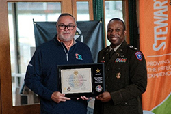 LTC Johnson presents Mr. Grimes with PaYS partnership Plaque.