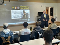 Roy briefs Carroll College ROTC Cadets on the Army PaYS program