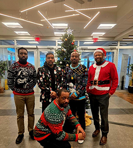 Some of the team in their ugly Christmas sweaters Some of the team in their ugly Christmas sweaters