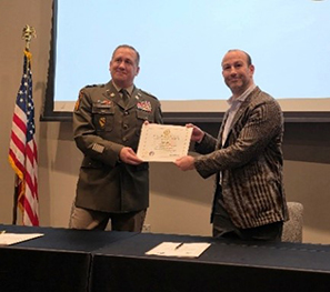 LTC Steiner and Mr. Lefenfeld holding the signed agreement LTC Steiner and Mr. Lefenfeld holding the signed agreement
