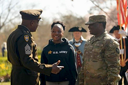 CSM Betty speaks with siblings PFC Farell Nganso and future Soldier Karell Nganso CSM Betty speaks with siblings PFC Farell Nganso and future Soldier Karell Nganso