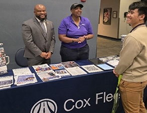 Victor observes Ms. Green of Cox Automotive speaking with Army PaYS Soldier SPC Jinaongkan