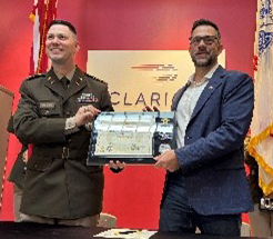 MAJ Springer presents a plaque to Mr. Nemecek