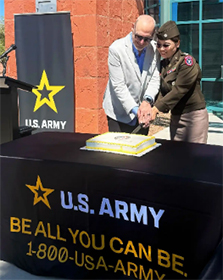LTC Song and Mr. Rogers cut the cake celebrating new partnership