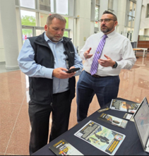 Roy speaks with expo attendee on the benefits of Army PaYS 